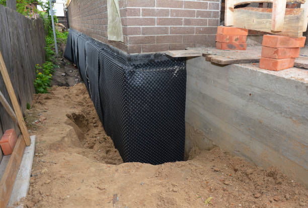 Happy homeowners after waterproofing job in Bucyrus